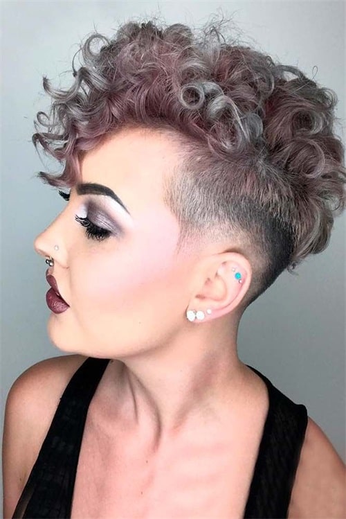 Curly taper haircut with highlights for women