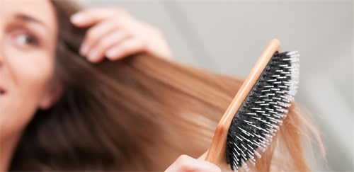Instead of tearing your hair with a regular brush or comb, consider investing in a comb.