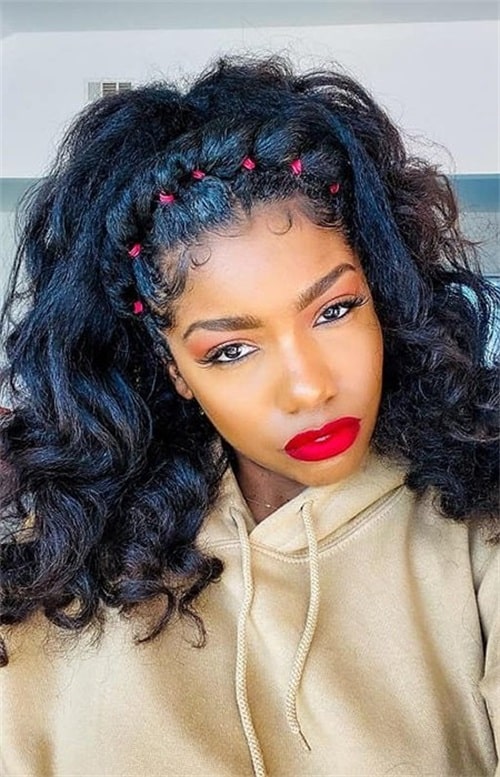 The rubber band contrasts sharply with the black hair