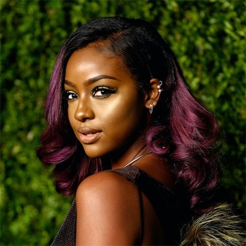 Black cherry hair is a dark and moist hue, it is a luxurious mix of deep purple and red with a hint of dark brown or black.